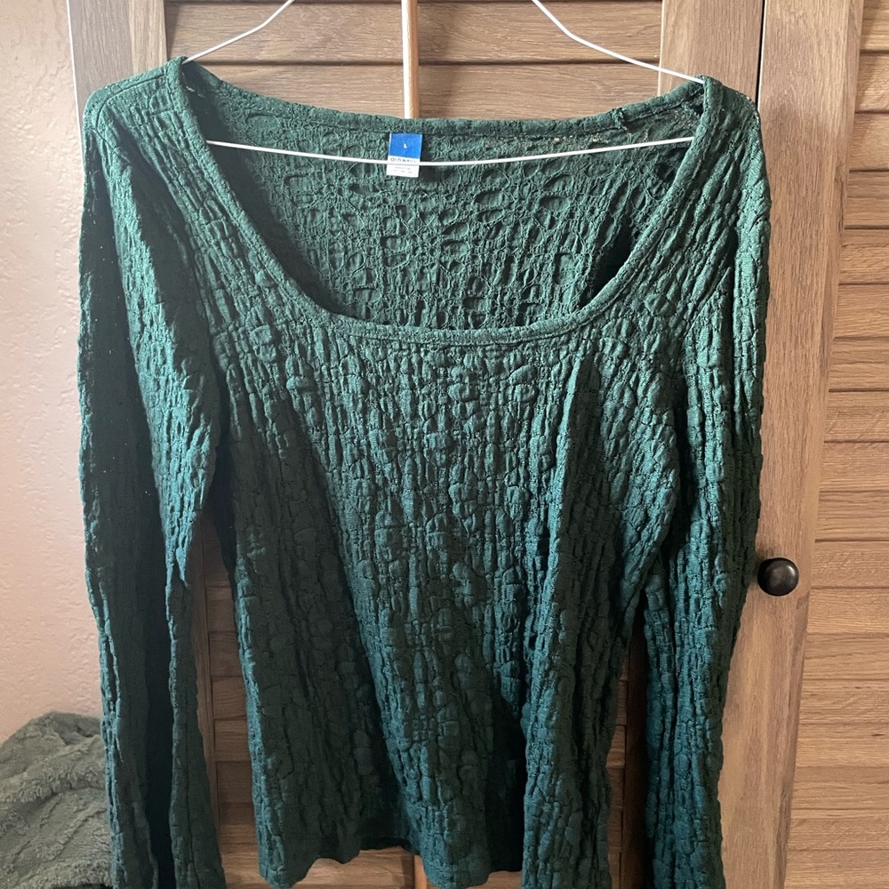 New/never worn. Textured green lacy women’s top